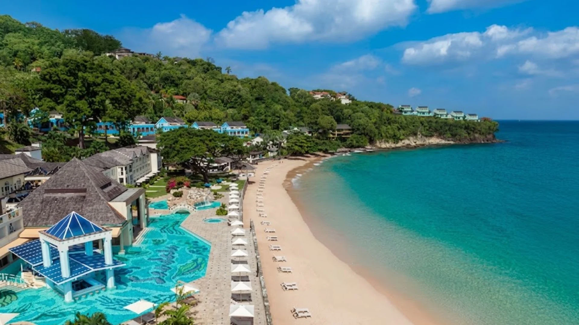 Sandals Resorts couples-only all-inclusive luxury Caribbean beachfront resort with overwater bungalows and turquoise ocean in Jamaica
